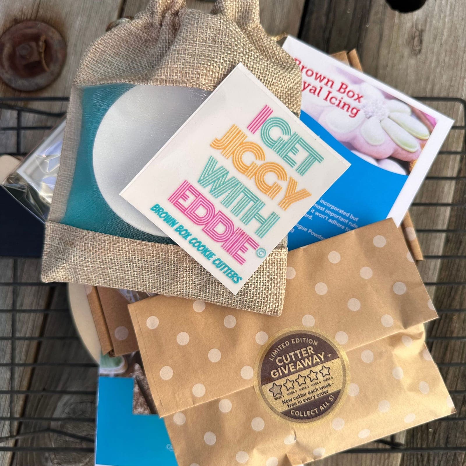 A Brown Box order: kraft polka-dot bags, an I Get Jiggy With Eddie sticker and a gold cutter-giveaway seal